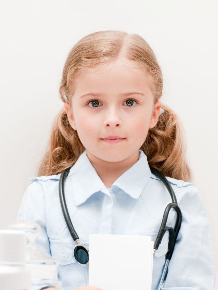 little girl playing doctor