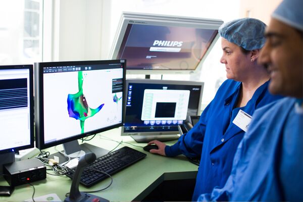 Technicians looking at screens during electrophysiology 