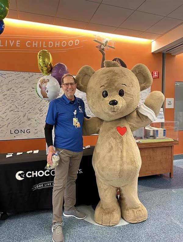 CHOC volunteer next to Choco