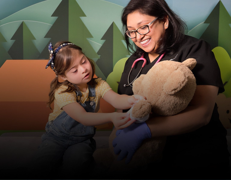 doctor and young girl holding choco bear