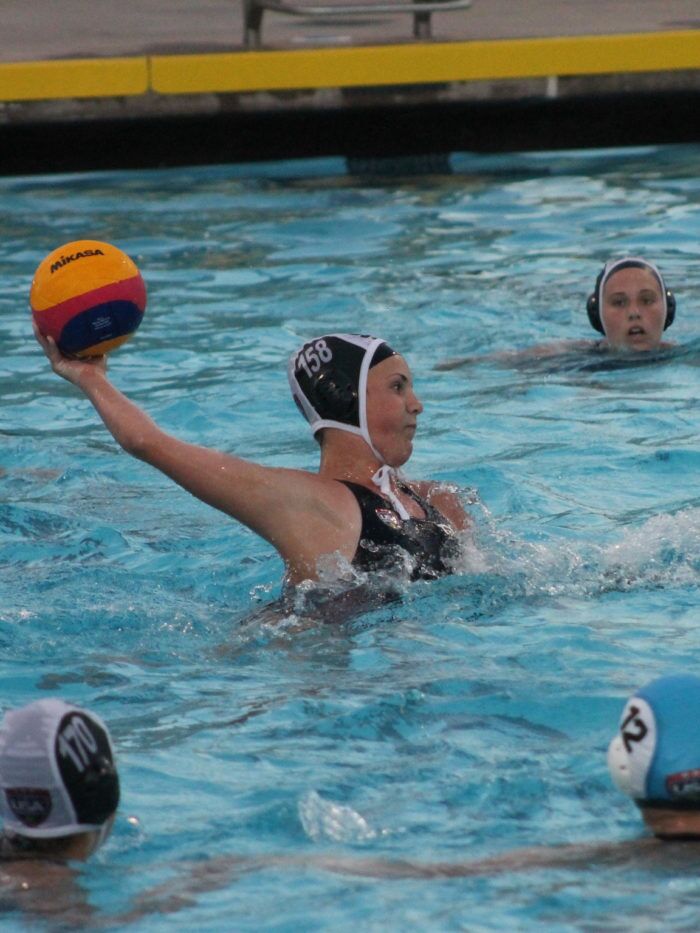 Nikki throwing a ball while playing water polo