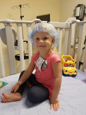 Mackenzie, a juvenile arthritis patient at CHOC, in hospital crib